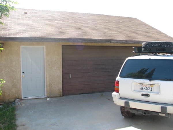 Same unattached garage with new door
